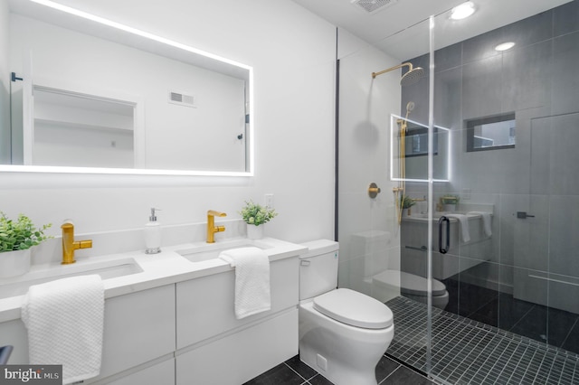 bathroom with tile patterned flooring, vanity, toilet, and walk in shower