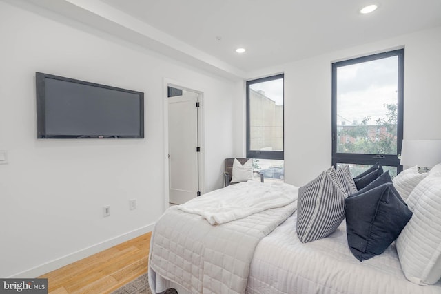 bedroom with hardwood / wood-style floors