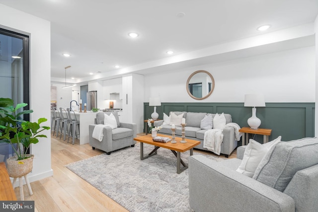 living room with light hardwood / wood-style flooring