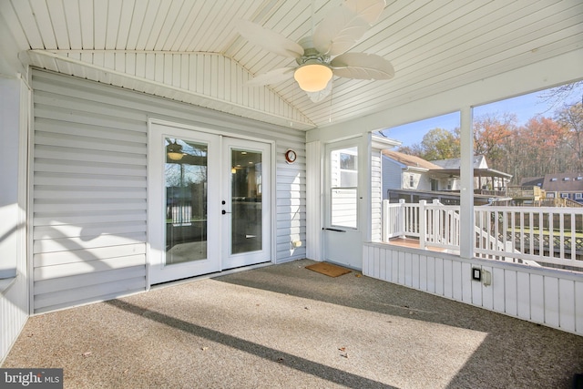 unfurnished sunroom with ceiling fan, lofted ceiling, wood ceiling, and french doors