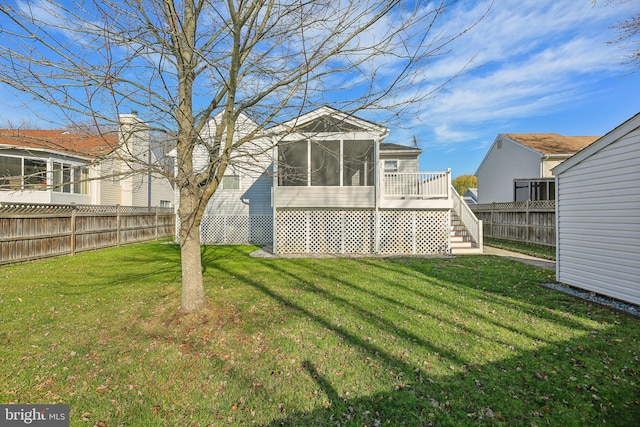 view of yard with a wooden deck and a sunroom