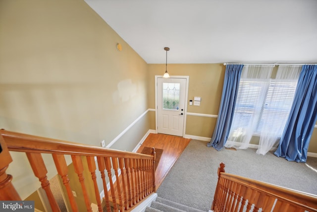 view of carpeted foyer entrance