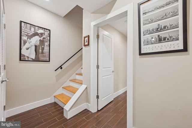 stairway with hardwood / wood-style floors