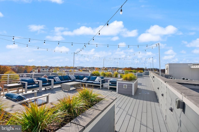 wooden deck featuring outdoor lounge area