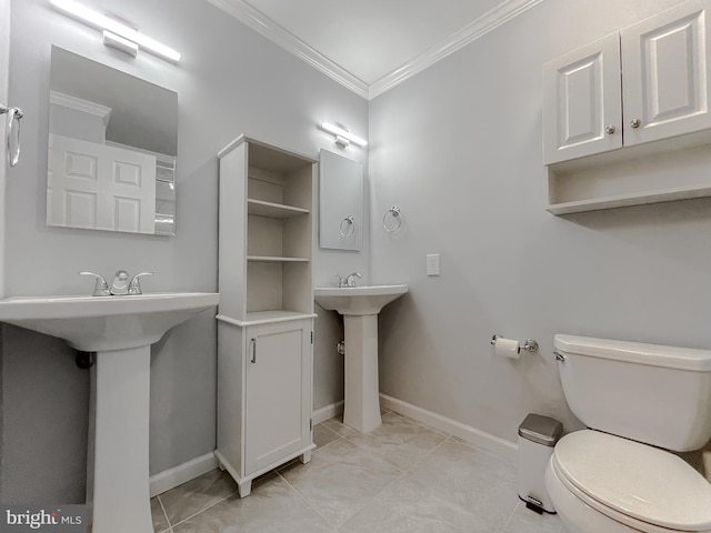 bathroom featuring toilet and ornamental molding