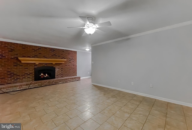 unfurnished living room featuring ceiling fan, light tile patterned flooring, ornamental molding, and a brick fireplace