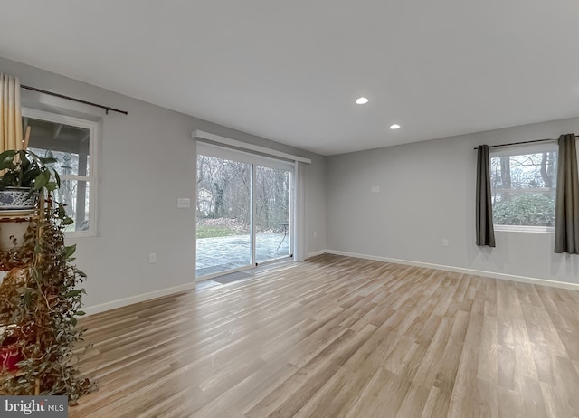 unfurnished room featuring light wood-type flooring