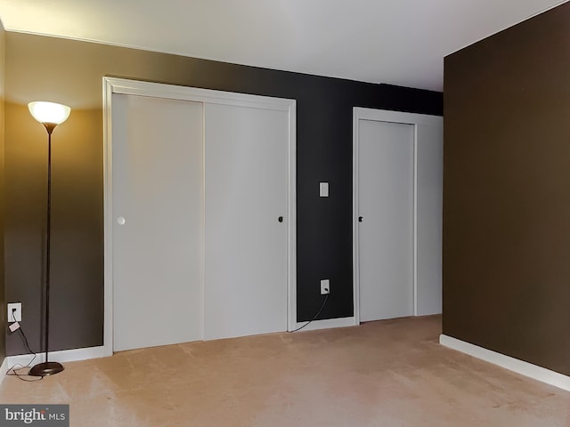 unfurnished bedroom with light carpet