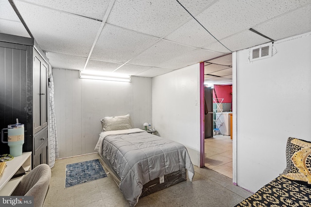 bedroom featuring a drop ceiling