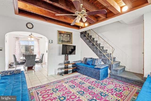 living room featuring ceiling fan, light tile patterned floors, and wood ceiling