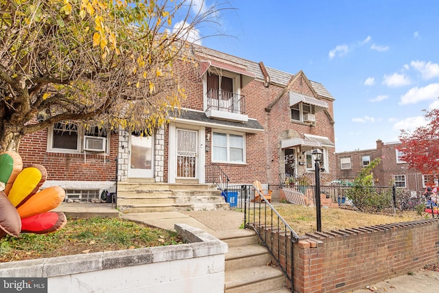 view of front of house featuring a balcony