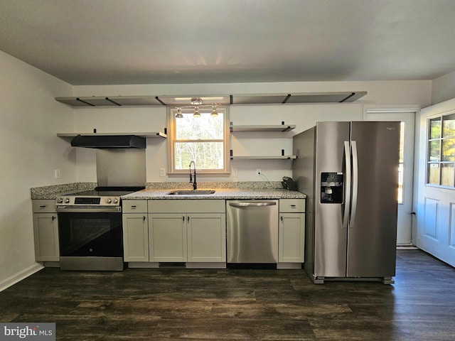 kitchen featuring stainless steel appliances, dark hardwood / wood-style floors, a healthy amount of sunlight, and sink