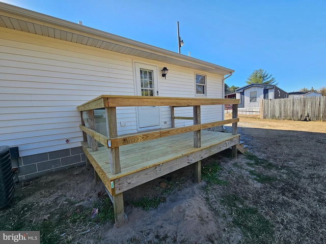 wooden deck with central AC unit