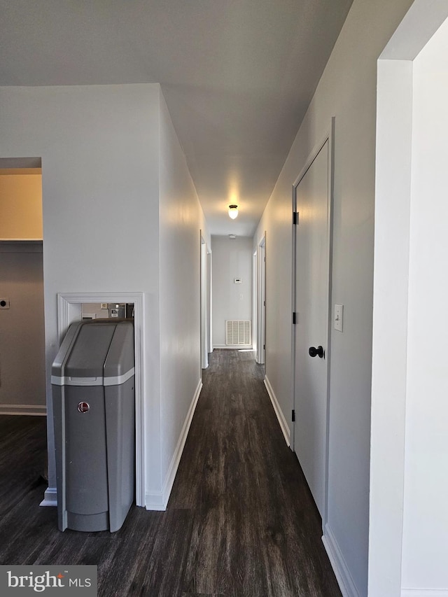 hallway with dark wood-type flooring