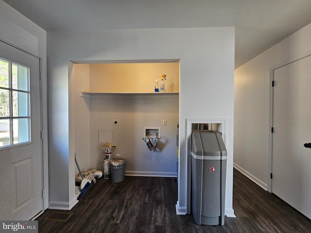 clothes washing area featuring hookup for an electric dryer, washer hookup, and dark hardwood / wood-style flooring