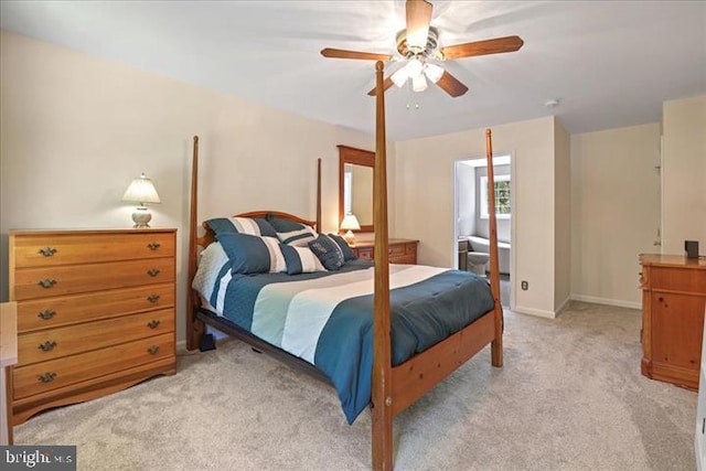 bedroom with ceiling fan and light carpet