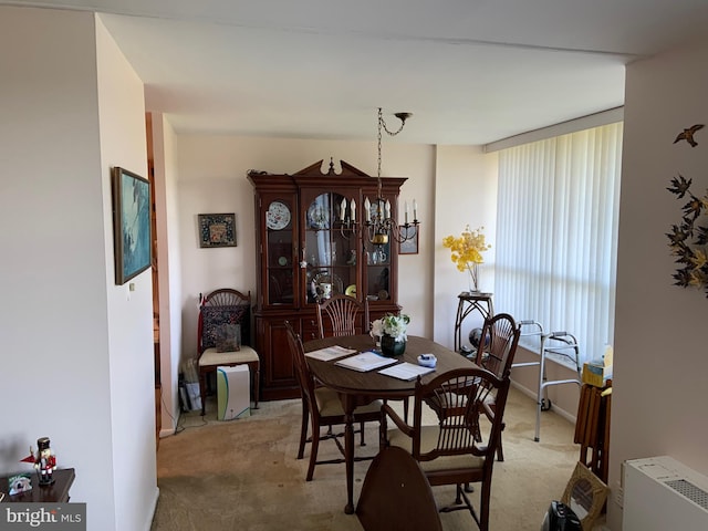 dining area with light colored carpet