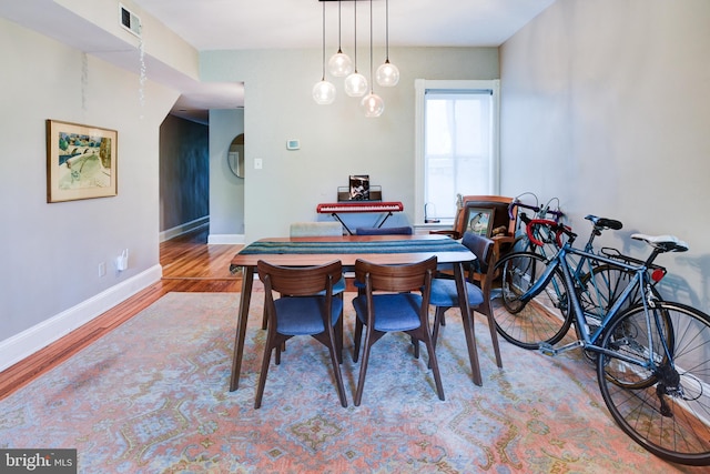 dining area featuring light wood-type flooring