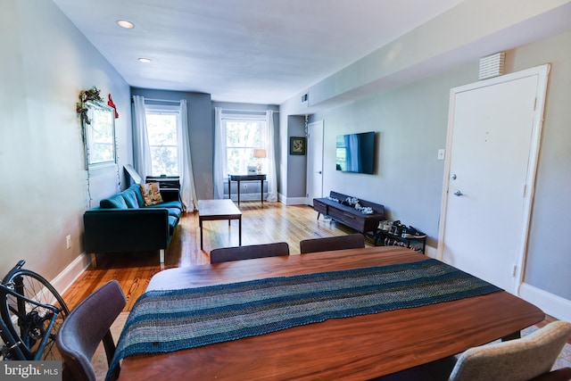 living room with light hardwood / wood-style flooring