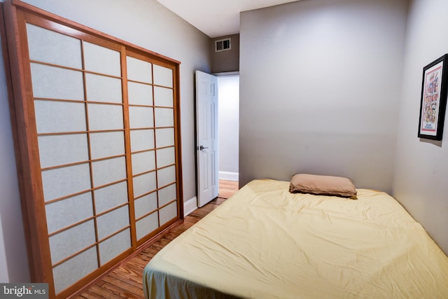 bedroom featuring wood-type flooring