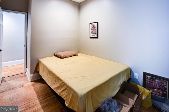 bedroom featuring hardwood / wood-style flooring