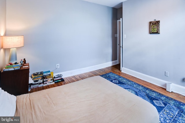 bedroom featuring dark hardwood / wood-style floors