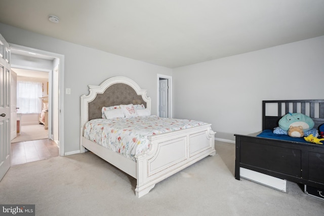 bedroom with light colored carpet