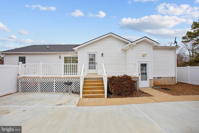 back of house with a patio and a deck