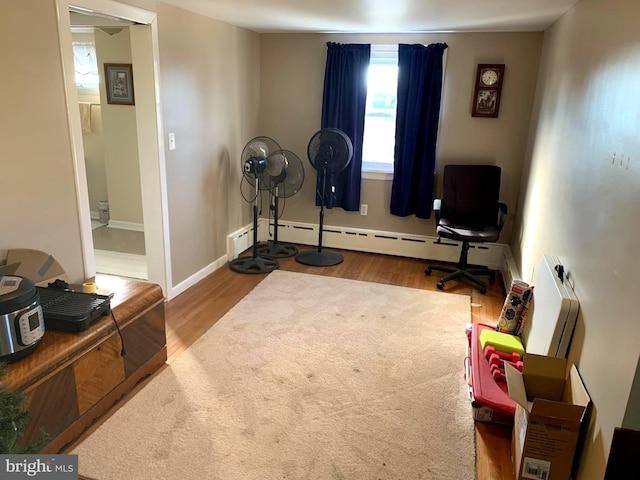 exercise room featuring wood-type flooring