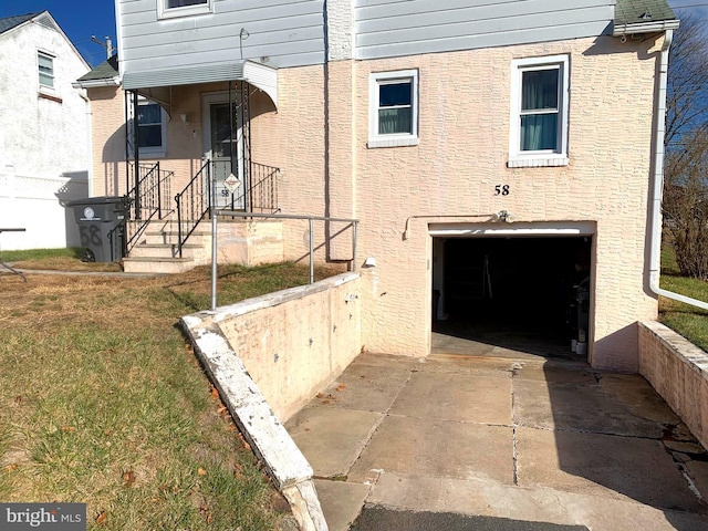 entrance to property featuring a garage