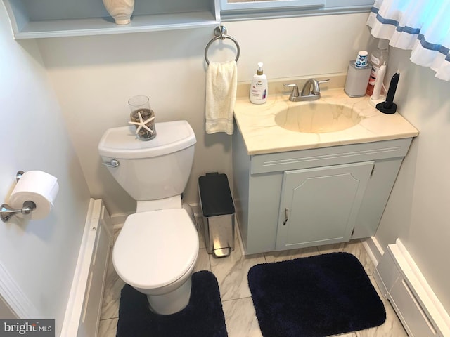 bathroom with tile patterned floors, vanity, and toilet