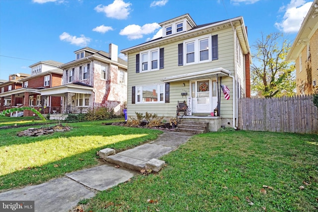 view of front of home with a front lawn