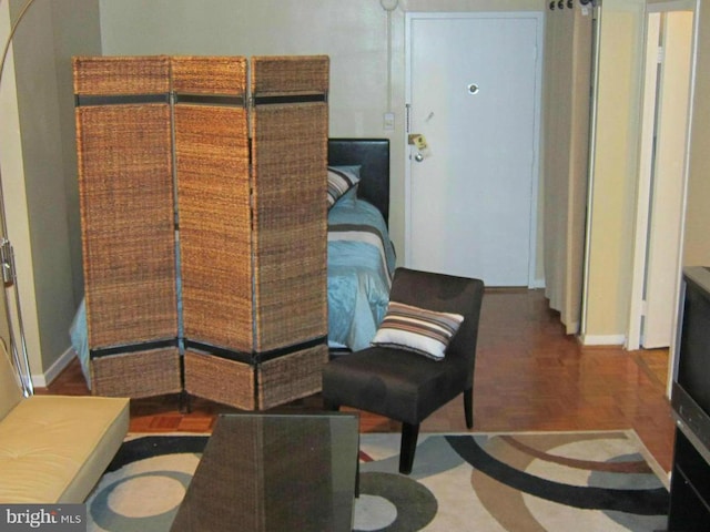 sitting room featuring parquet floors