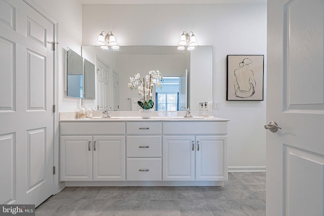 bathroom featuring tile patterned flooring and vanity