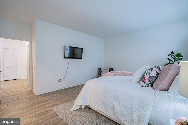 bedroom with light hardwood / wood-style floors