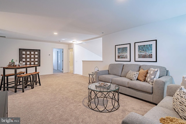 living room featuring light carpet