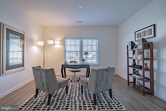 dining room with plenty of natural light and light wood-type flooring