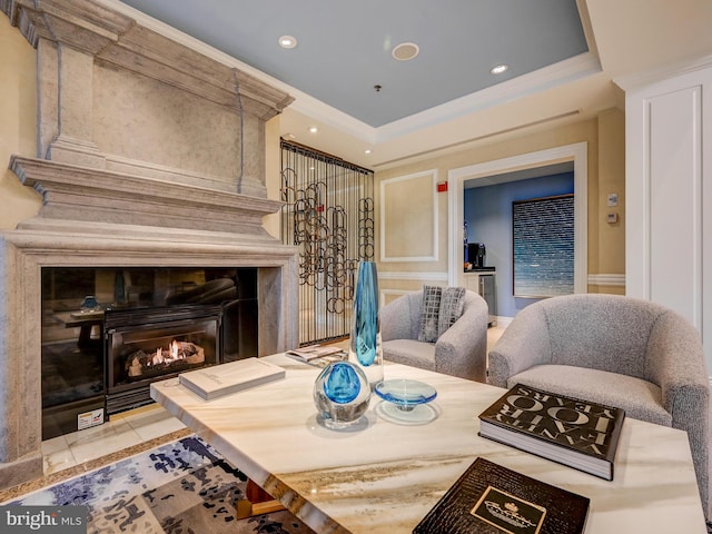 801 Key Hwy Unit 323, Baltimore, MD 21230 - tiled living area featuring crown molding, recessed lighting, a tray ceiling, and a fireplace