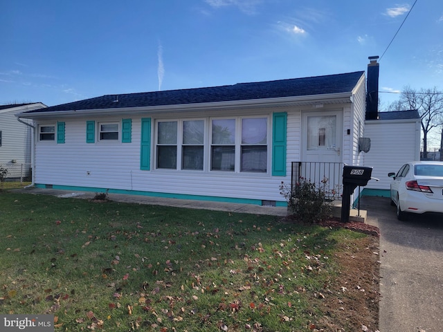 view of front of home with a front lawn