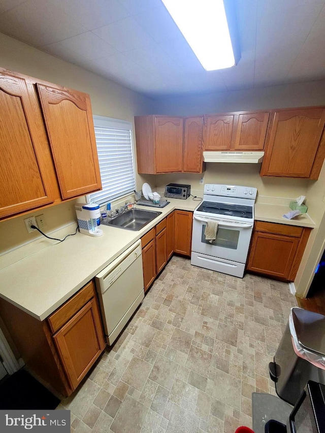 kitchen with white appliances and sink