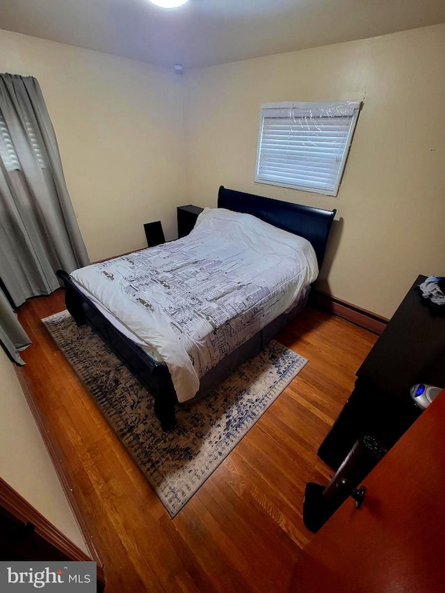 bedroom featuring wood-type flooring