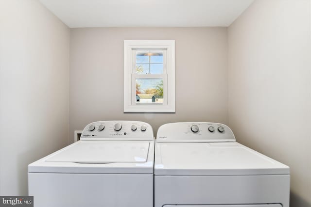 clothes washing area with washer and dryer