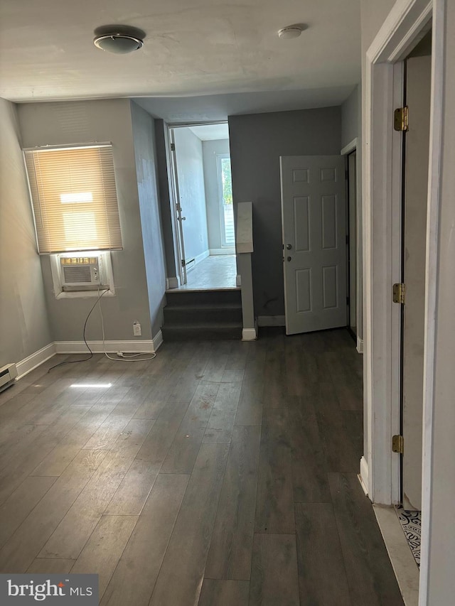 hall with cooling unit and dark hardwood / wood-style flooring