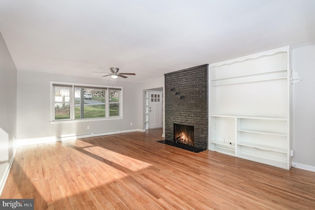 unfurnished living room with a brick fireplace, ceiling fan, light wood-type flooring, and a baseboard radiator