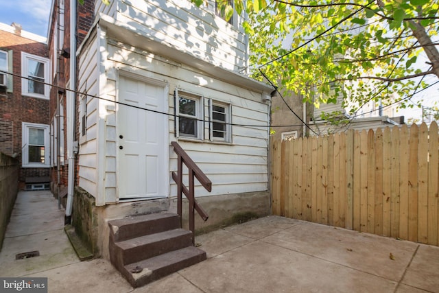 entrance to property with a patio area