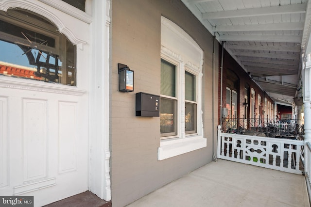 property entrance with covered porch