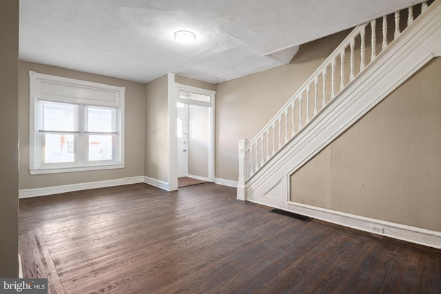 foyer featuring dark wood-type flooring