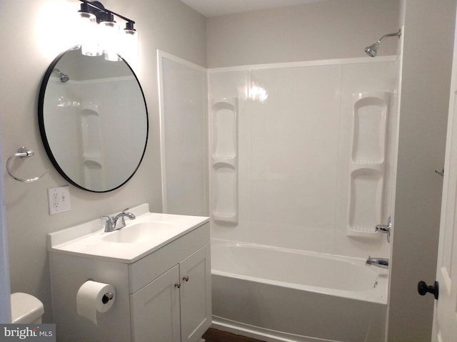 full bathroom featuring vanity,  shower combination, and toilet