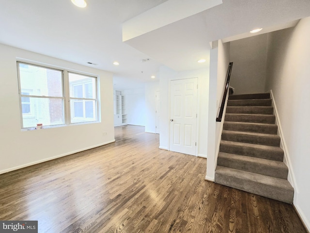 stairs with wood-type flooring