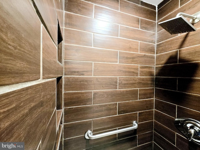 bathroom with tiled shower